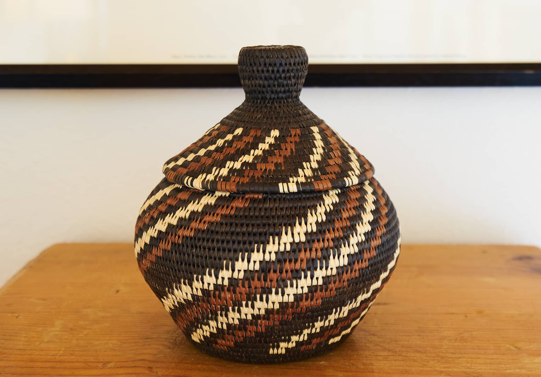 A small decorative woven basket
