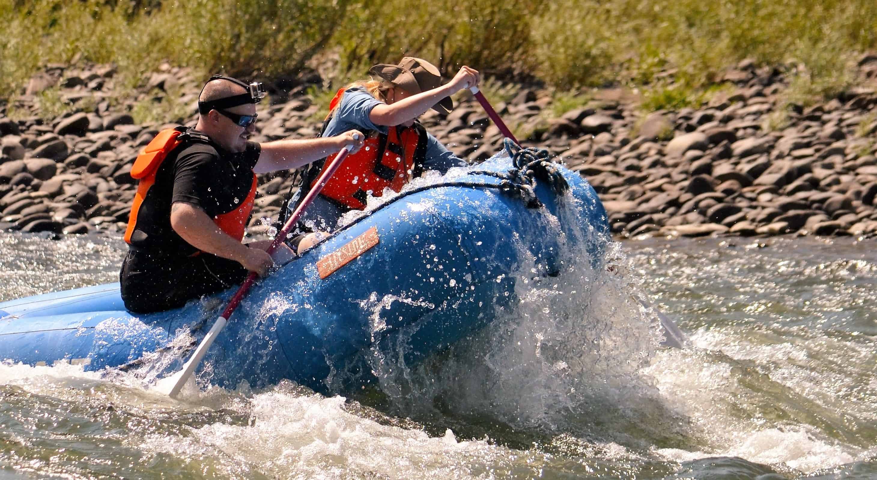 Two people whitewater rafting